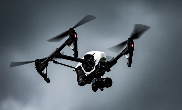 Drones could deliver packages more efficiently by hopping on the bus