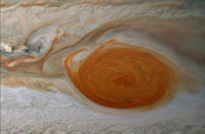 Jupiter's Great Red Spot feeds on smaller storms