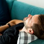 Why you fall asleep on the couch but lie awake in bed